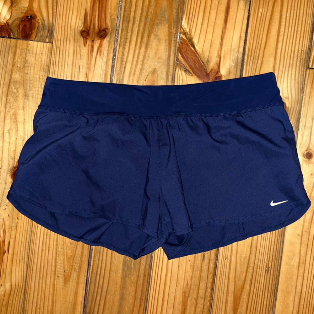 Blue Nike running shorts